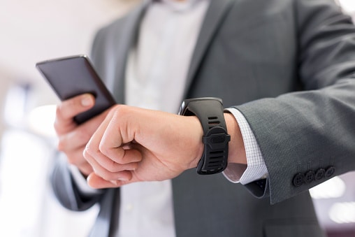 Consultation call - Man with Mobile phone connected to a smart watch