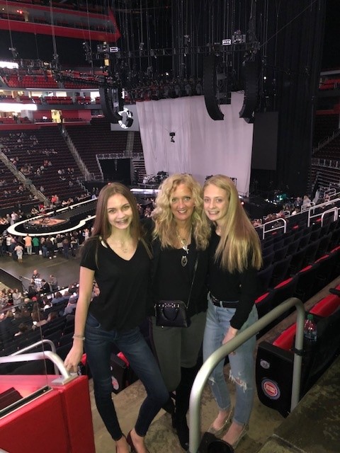 Three women at a concert