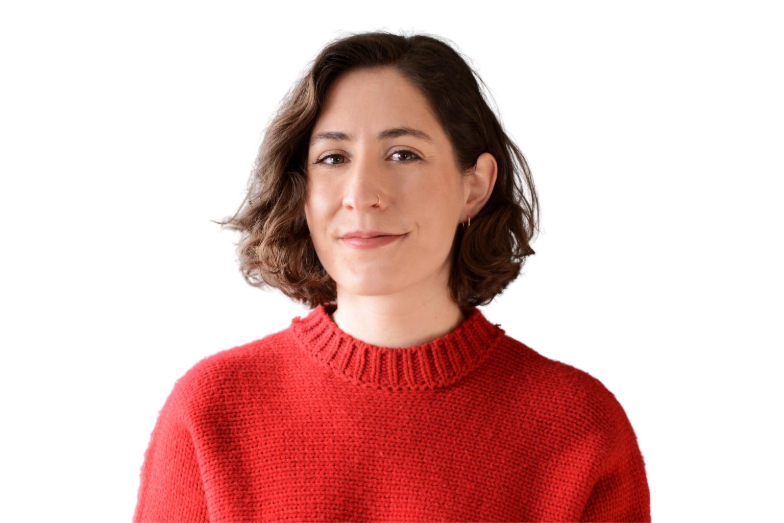 Professional portrait of recruiter Miriam Poole in a red sweater with a white background.