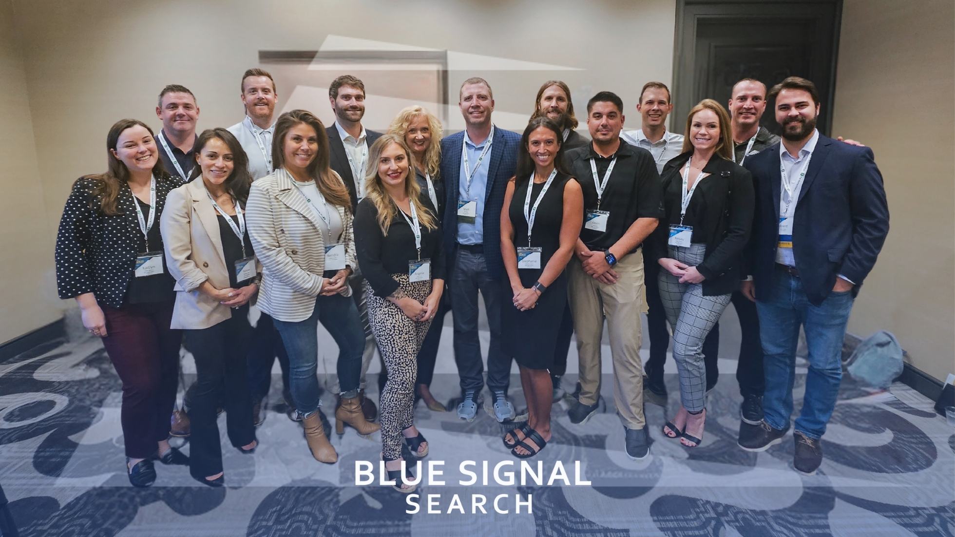 Group photo of the Blue Signal Search recruiting team at the NAPS 2023 Conference, with team members smiling and posing in professional attire, showcasing the company's collaborative spirit.