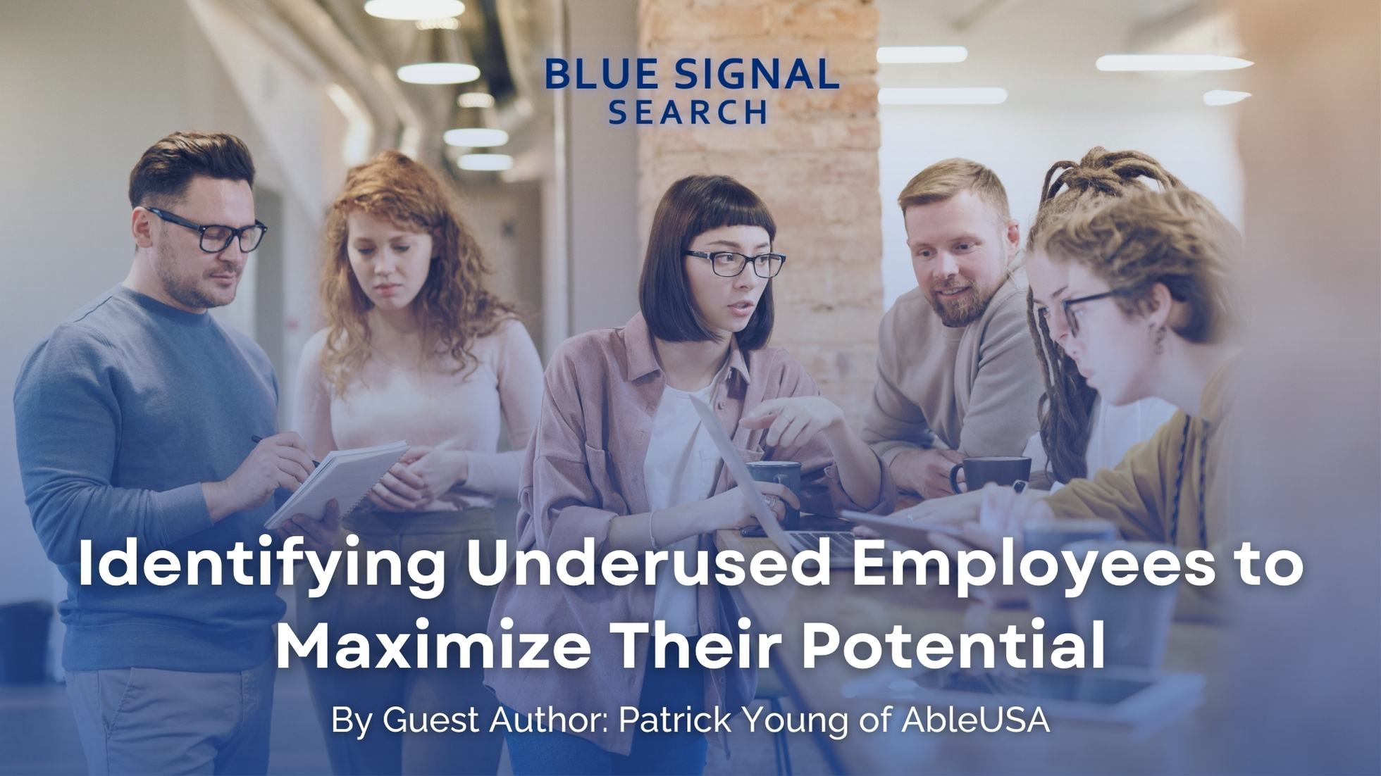 A team engaging in a collaborative discussion, highlighting the topic of the blog 'Identifying Underused Employees to Maximize Their Potential' by guest author Patrick Young.