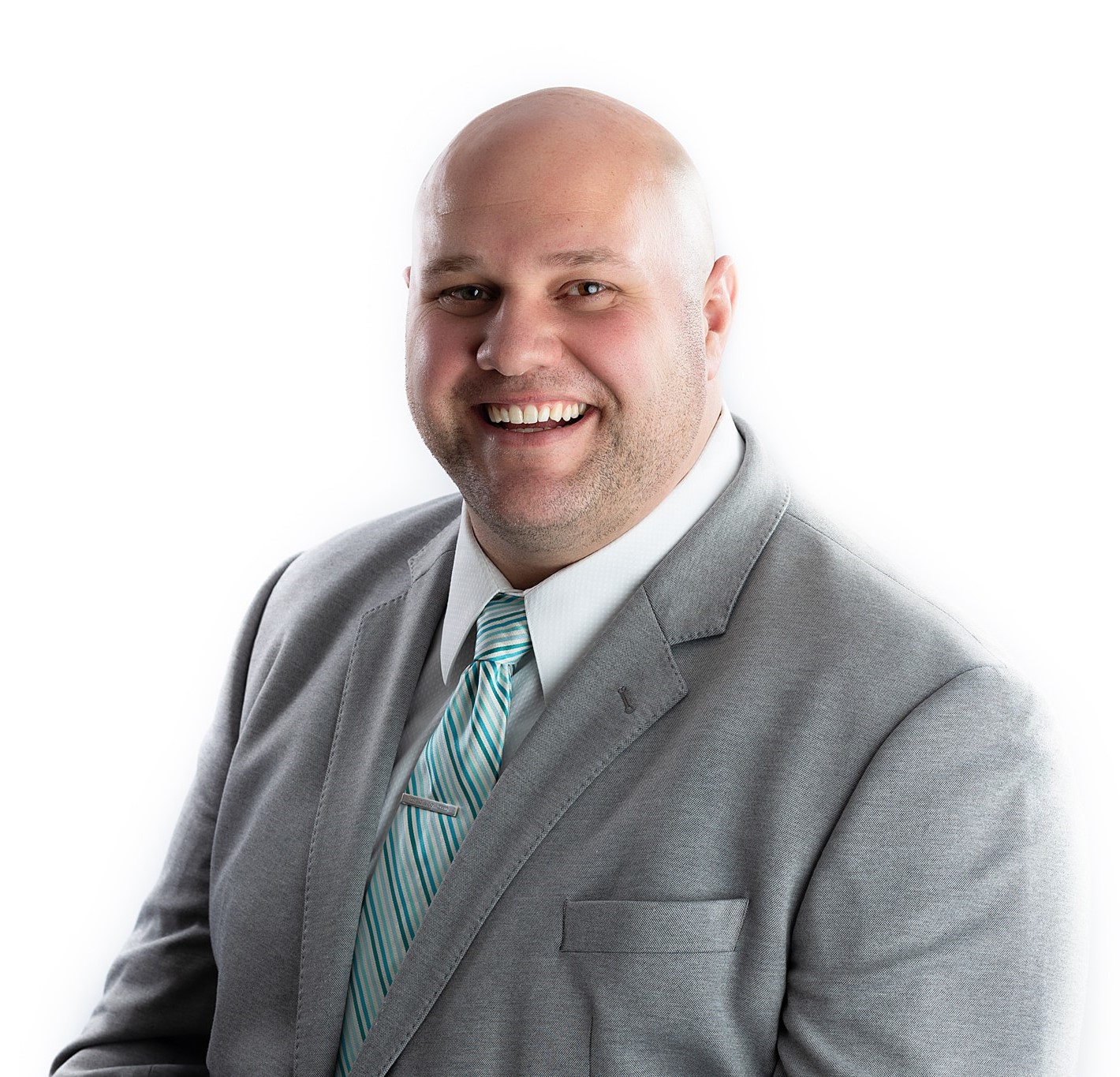 Jordan Lawhead, Vice President at Blue Signal, smiling in a professional headshot with a grey suit and teal striped tie.
