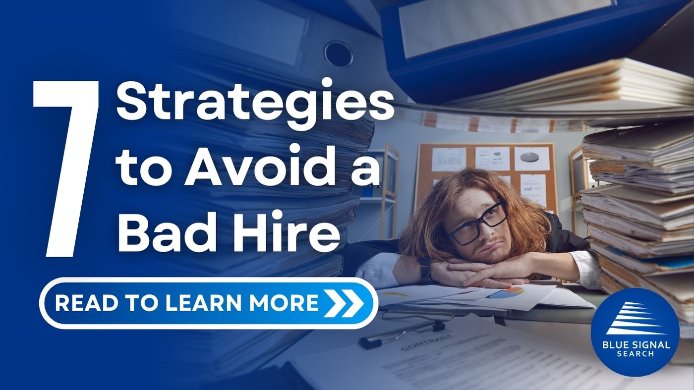 Overwhelmed office worker surrounded by stacks of paperwork with the text '7 Strategies to Avoid a Bad Hire' and Blue Signal Search logo.