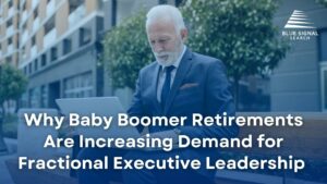 Older professional man in a suit using a laptop outdoors, representing the demand for fractional executive leadership due to baby boomer retirements.