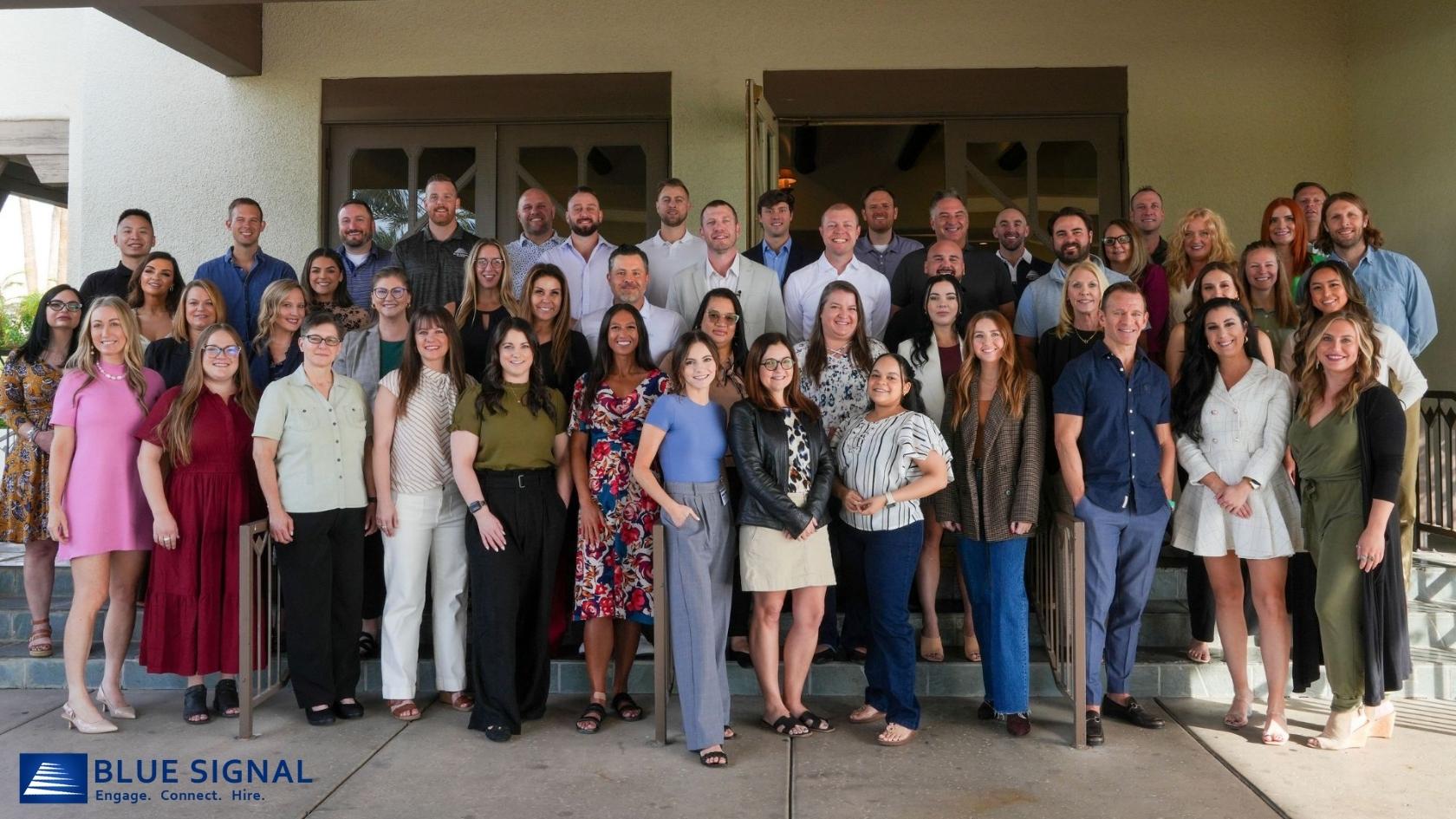 Group photo of Blue Signal team members gathered at the Wigwam Resort for the 2024 Summit.