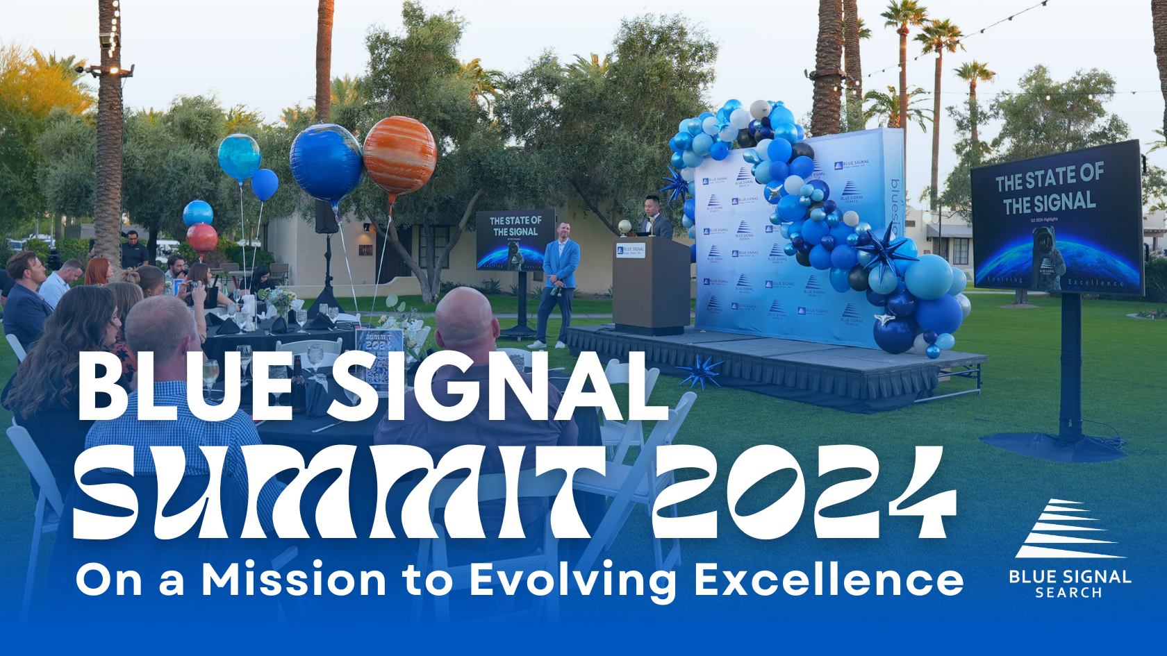 Blue Signal Summit 2024 attendees seated outdoors at Wigwam Resort, with space-themed decor and 'On a Mission to Evolving Excellence' theme.