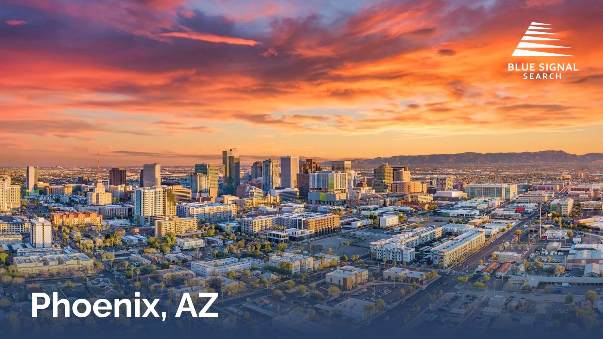 Downtown Phoenix skyline at sunset with colorful desert skies and modern high-rise buildings.