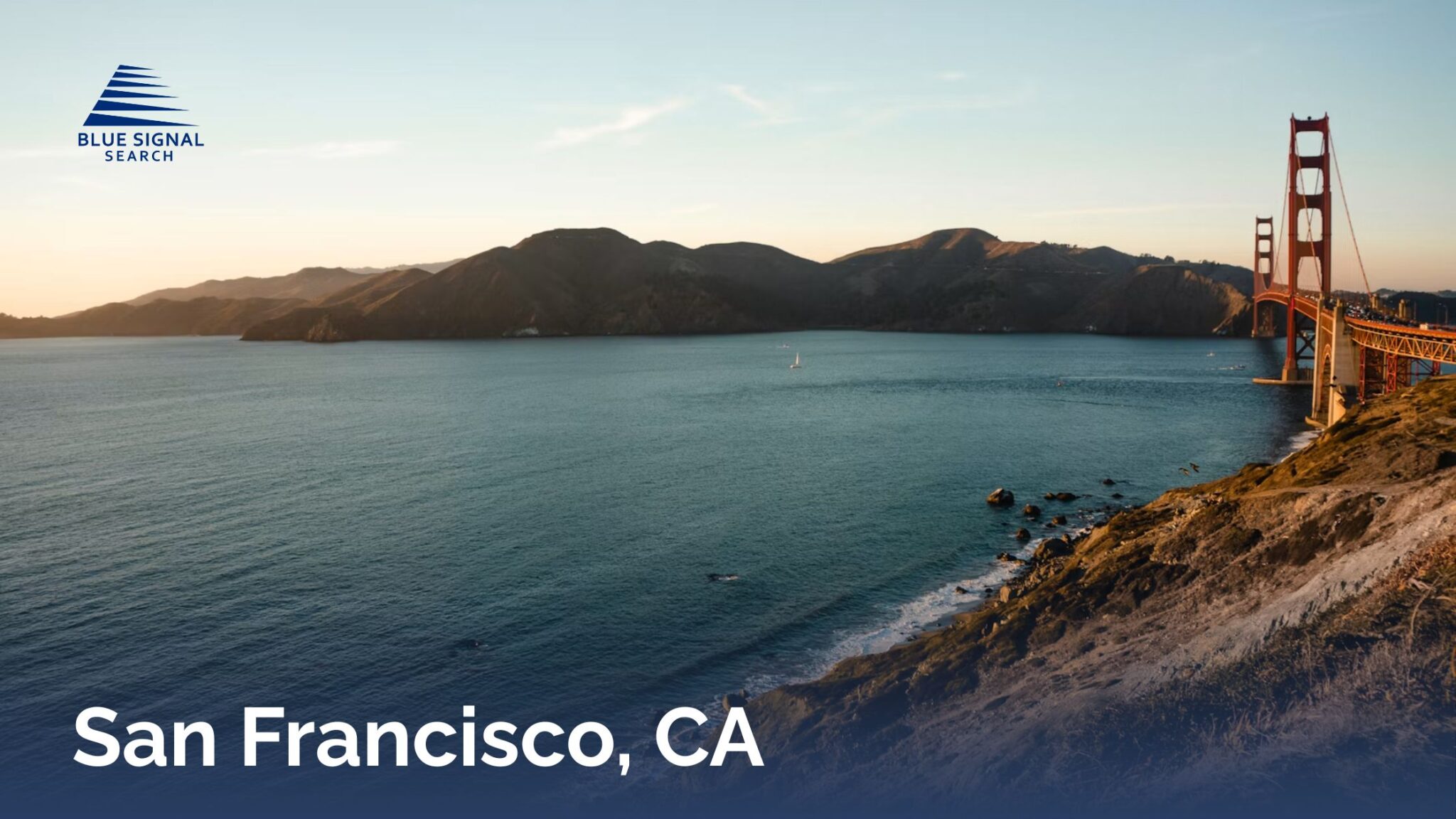 Golden Gate Bridge spanning San Francisco Bay with surrounding coastline and hills.